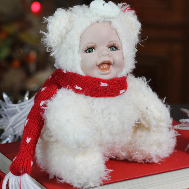 porcelain doll with teddy bear